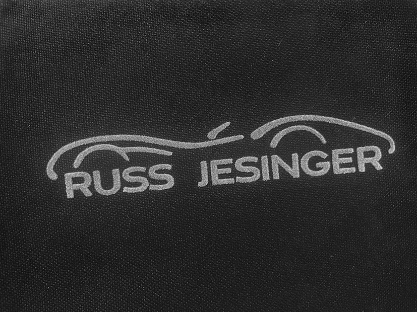 Referenz: Arbeitskleidung veredelt Flocktransferdruck für das Autohaus Russ Jesinger.